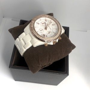 White women’s Michael Kors watch crystal front